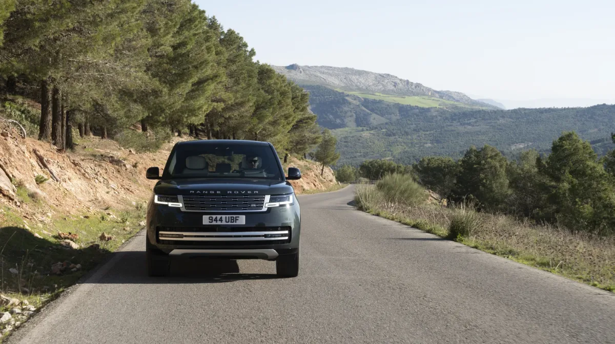 The Range Rover Electric photographed head-on while driving on a mountain road